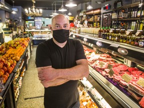 Ernesto Monte is the owner of Royal York Meat Market in Toronto. Here he is on Tuesday, the first day of the mandatory face-covering bylaw in the city. Ernest Doroszuk/Toronto Sun/Postmedia