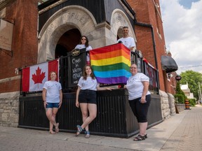 Strathroy Pride organizers Michelle Callipari and Frank Emanuele (above) and Kirby Traczuk, Lauren Huston and Kelly Flemming (below) stand in front of the Clock Tower Inn and Bistro, where a rainbow flag now hangs outside ahead of Saturday's first-ever virtual pride event. (Max Martin/The London Free Press)