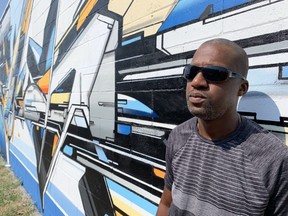 London artist Evond (Mediah) Blake completed Substrait — the first of three murals he was commissioned to paint this summer — at CTP Computers, 707 Talbot St., in St. Thomas. (Paul Vanderhoeven/The London Free Press)