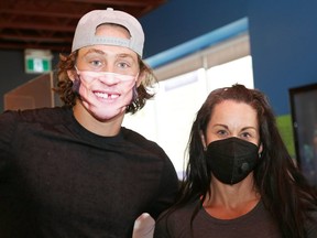 NHL player Tyler Bertuzzi and Kim Brouzes, of Active Therapy Plus, are selling masks with his face on them as a fundraiser for Northern Ontario Families of Children with Cancer. (John Lappa/Postmedia Network)