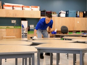 Chief custodian Brian Szabadkay cleans and disinfects all areas of Kanata Highlands Public School to get ready for a return to classes.