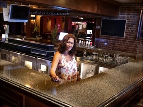 Donna Cotton, a.k.a. Queen of Crescent Street, behind the section of the bar that was her's before calling it quits after 39 years of bartending in Montreal, on Monday, August 17, 2020.