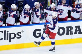 Liam Foudy celebrates his third-period goal with the Columbus Blue Jackets bench in Game 5 of the Eastern Conference Qualification Round against the Toronto Maple Leafs on Aug. 9 at Scotiabank Arena in Toronto. (Andre Ringuette/Freestyle Photo/Getty Images)
