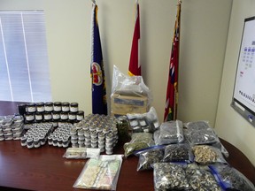 Police seized $24 million in assets, including more than $100,000 cash and $66,000 worth of magic mushrooms and cannabis shown here, in a series of searches on Wednesday, July 29, 2020, as part of Operation Hobart, an ongoing investigation targeting an alleged gambling ring that police contend is linked to the Hells Angels. (OPP supplied photo)