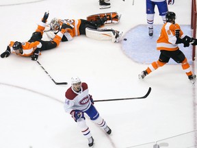 Montreal Canadiens centre Nick Suzuki (14) celebrates his goal against the Philadelphia Flyers during the third period in Game 5 of the first round of the 2020 Stanley Cup Playoffs at Scotiabank Arena. It stood up as the winning goal. John E. Sokolowski-USA TODAY Sports