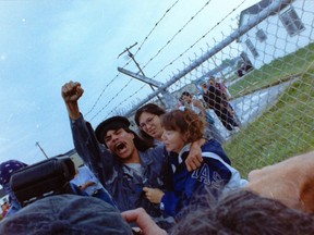 Stacey George raises his fist in the air and shouts amid protests at Ipperwash Provincial Park in the days after the September 1995 killing of his friend Dudley George, an unarmed protester who was shot dead by an Ontario Provincial Police sniper. (Ken Wightman/The London Free Press)