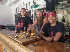 L to R Tytan Bruckschwaiger, Rob Dundas and Aran Kam have opened the Doing Fine Kitchen at Dundas and Sons Brewing Company in London. On display are a selection of sliders (walleye, beer smash burger, jerk chicken and pulled pork). (Derek Ruttan/The London Free Press)