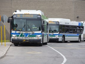 London Transit Commission buses line up at White Oaks Mall in London on Wednesday. London Transit commissioners praised a package from the federal and provincial governments that will cover pandemic-related losses. (Derek Ruttan/The London Free Press)