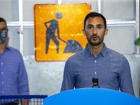 Labour Minister Monte McNaughton looks on as Education Minister Stephen Lecce speaks about the province's plans to put $43 million into promoting skilled trades training at London Children's Museum on Thursday. (Derek Ruttan/The London Free Press)