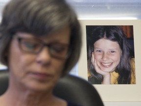 With an image of her 12-year-old self behind her, Irene Deschenes held a press conference to announce that she has won a court challenge to re-open a civil suit against the Catholic Church that was originally settled in 2000. The photo behind her was taken by her abuser, Catholic priest Charles Sylvestre. Photo shot in Strathroy on Thursday December 6, 2018. Derek Ruttan/The London Free Press/Postmedia Network