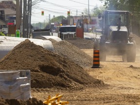 In late May, work continued on the project to separate sanitary and storm sewers in the Hamilton Road and Egerton Street area, one of the things the city is doing to reduce river pollution amid more intense and frequent storms expected from climate change. Much of city council's environmental action plan has been delayed by the pandemic. (Mike Hensen/The London Free Press)