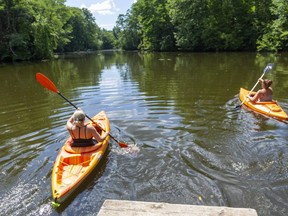 Shelley Crosby and Stephanie MacDonald of Strathroy leave the small dock on Clarke's Mill Pond near Mt. Brydges to enjoy some kayaking, west of London.  (Mike Hensen/The London Free Press)