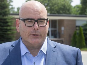 Steven Del Duca, the leader of the Ontario Liberal party talks about the Doug Ford back to school plan in front of St. Mark Catholic elementary school in London, Ont.  (Mike Hensen/The London Free Press)