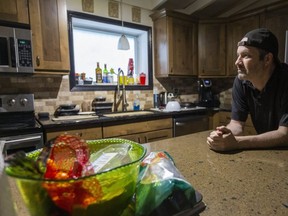Colin Egan stands in his kitchen he shares with Western students in London, Ont. The change from CERB to unemployment will affect Egan. (Mike Hensen/The London Free Press)