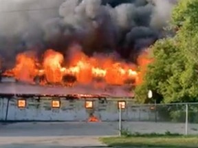 Firefighters from Woodstock, Ingersoll and other municipalities were called to a barn fire at the Woodstock Fairgrounds Tuesday evening. FACEBOOK