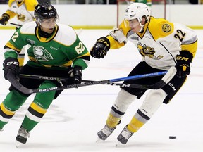 London Knights' Sahil Panwar battles Sarnia Sting's Justin O'Donnell during a game at Progressive Auto Sales Arena in Sarnia, Ont., on Saturday, Aug. 31, 2019. (Mark Malone/Postmedia Network)