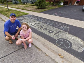 Aaron Johnson and his nine-year-old daughter Chelsey Anderson-Johnson only needed 90 minutes to create a back-to-school themed chalk art drawing in front of their Brantford home. They have been doing the artwork each September for the past thre years. Brian Thompson