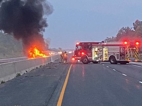 Middlesex OPP closed a portion of Highway 401 southwest of London Thursday morning after an SUV caught fire and a second car crashed with a tractor trailer.  (OPP photo)