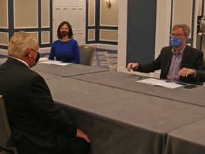 Premier Ford, left, meets with Mayor Jim Watson, and Dr. Vera Etches, Chief Medical Officer of Health for Ottawa Public Health at the Château Laurier on Friday.