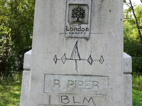 The plaque on the refurbished Meadowlily Road bridge has been marked and defaced. 
 (Submitted photo)