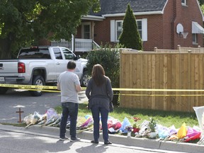 A steady stream of mourners arrive at the Oshawa home where a father and his three children were slain on Sunday September 6, 2020. Veronica Henri/Toronto Sun/Postmedia Network