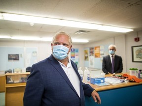 Ontario Premier Doug Ford takes a tour of Kensington Community School to see the measures implemented as students return to school amidst the COVID-19 pandemic on Tuesday, September 1, 2020. (THE CANADIAN PRESS/Carlos Osorio)