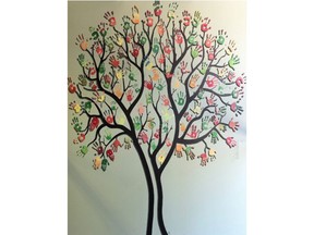 This hand tree mural contains the painted handprints of former refugee clients who have been supported by the London Cross Cultural Learner Centre.  It is located in the main lobby of the CCLC office.