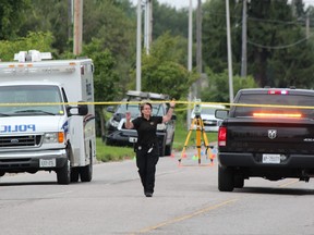 London police closed off a section of Gainsborough Road Saturday after a 77-year-old male cyclist was killed in a collision with a pickup truck around 11:30 a.m., police said. DALE CARRUTHERS / THE LONDON FREE PRESS