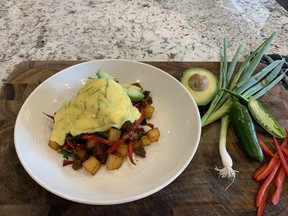 Chef Erin Circelli Russell's  crispy potato and chorizo hash with soft poached eggs, avocado and hollandaise.