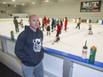 Total Package Hockey owner Dwayne Blais on the bench at Wester Fair Sports Centre with one of his hockey camps taking place behind him in London. (Derek Ruttan/The London Free Press)