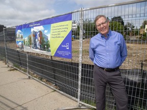 Jerry White, a London Community Foundation board member and chair of Vital Signs, stands outside the future site of Embassy Commons in London Thursday. When completed in 2022, Embassy Commons will feature 72 affordable housing units and a retail space. (Derek Ruttan/The London Free Press)