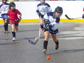 Ilderton Jets player Ava Regier fires a pass during a U9 semifinal game against The Bad Girls at the HockeyFest road hockey tournament in London on Sunday September 13, 2020. (Derek Ruttan/The London Free Press)
