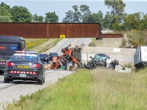A 54-year-old Glencoe man suffered serious injuries and a section of Longwoods Road near Glencoe was closed for hours after a pickup and flatbed truck collided head-on between Thames and McArthur roads in Southwest Middlesex about noon Wednesday, Sept. 16, provincial police say. (Derek Ruttan/The London Free Press)