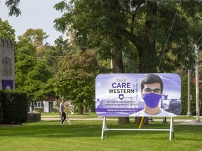 A sign at the front gates to Western University reminds students to be socially responsible in London. (Derek Ruttan/The London Free Press)