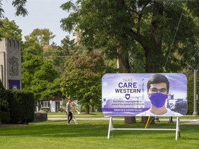 A sign at the front gates to Western University reminds students to be socially responsible in London. (Derek Ruttan/The London Free Press)