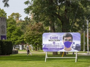A sign outside Western University campus reminds students to be socially responsible. (Derek Ruttan/The London Free Press)