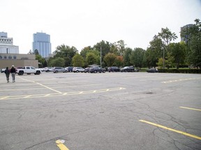 A proposal has been made to build two towers on this parking lot beside Centennial Hall across the street from Victoria Park in London. (Derek Ruttan/The London Free Press)