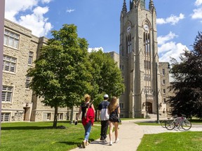 Cathy Gallagher of Milton brought her daughter Meaghan McDonagh, 16, and her daughter's boyfriend Diego Velasco, 17, to the Western University campus to look around, a full year before her daughter hopes to attend to study psychology. (Mike Hensen/The London Free Press)