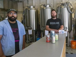 Adil Ahmed and Nick Baird, co-owners of Beerlab! on Talbot Street in downtown London, are partnering with Milos Craft Beer Emporium, owned by Milos Kral, on an expansion that will add patio and indoor space to the neighbouring establishments. (Mike Hensen/The London Free Press)