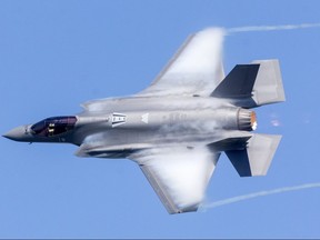 A US Airforce F-35 Lightning, part of their demonstration team, has vapour form off its wings and vortices off the wingtips as it practices at the London International Airport for Airshow London. The water vapour is caused when extreme speed or manoeuvres cause condensation to form. (Mike Hensen/The London Free Press)