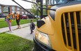 A returning pupil steps off the school bus at Lord Nelson elementary school in east London.
Photograph taken on Monday September 14, 2020. 
Mike Hensen/The London Free Press/Postmedia Network
