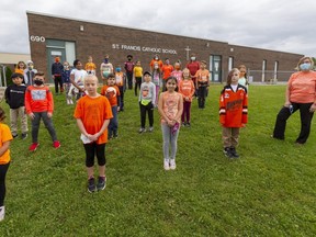 Students from the Grade 4 class at St. Francis Catholic elementary school in London are pictured Wednesday on Orange Shirt Day, an annual effort intended to remember the awful history of residential schools here and across Canada. Photograph taken on Wednesday September 30, 2020. Mike Hensen/The London Free Press