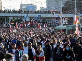 Opposition supporters march during a rally to demand the resignation of Belarusian President Alexander Lukashenko on Sunday, more than a month after the disputed presidential election, in Minsk, Belarus. (BelaPAN via REUTERS)