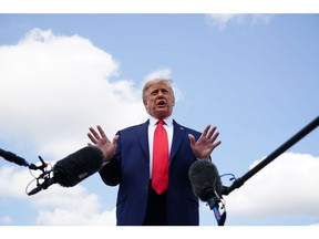 U.S. President Donald Trump stops to talk to reporters as he makes his way to board Air Force One on Sept. 8, 2020.