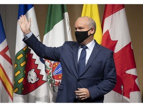 Conservative Leader Erin O'Toole waves to members of the national caucus at the start of their meeting in Ottawa, Wednesday.