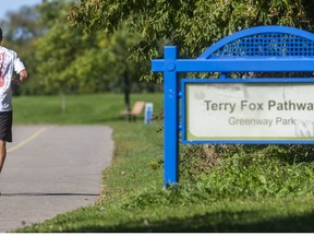 Brent Carrothers enters the Terry Fox Parkway as he attempted to retrace the Terry Fox run through London forty years ago in London. (Mike Hensen/The London Free Press)