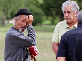 Joe Miskokomon, one of four deputy grand council chiefs of the Anishinabek Nation, watches as Pierre George wipes away a tear on the 25th anniversary of the shooting death of his younger brother Dudley George on Sunday September 6, 2020. Terry Bridge/Sarnia Observer/Postmedia Network