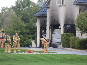 London firefighters were at the scene of a house fire southwest of the city, which caused more than $150,000 in damages to a home on Homewood Lane. (JONATHAN JUHA/The London Free Press)