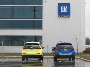 Two electric vehicles are getting charged at the General Motors plant in Oshawa on November 26, 2018.