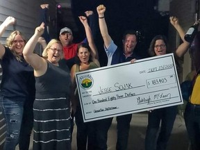 Ashleigh McLean, left, Stephanie McCallum, Jeremy Gough, with the Glencoe Agricultural Society, and Carly Fraleigh present a cheque to Glencoe resident Jesse Sojak, who won more than $180,000 in a 50/50 jackpot. Joined by Kathryn Lambert and Celeste McEachren, also with the agricultural society. (Photo supplied by Ashleigh McLean)